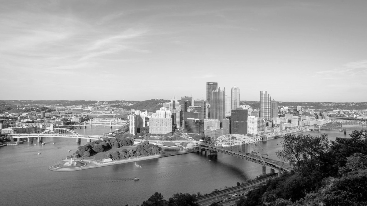 Pittsburgh&rsquo;s three rivers meeting at the Point, with downtown beyond