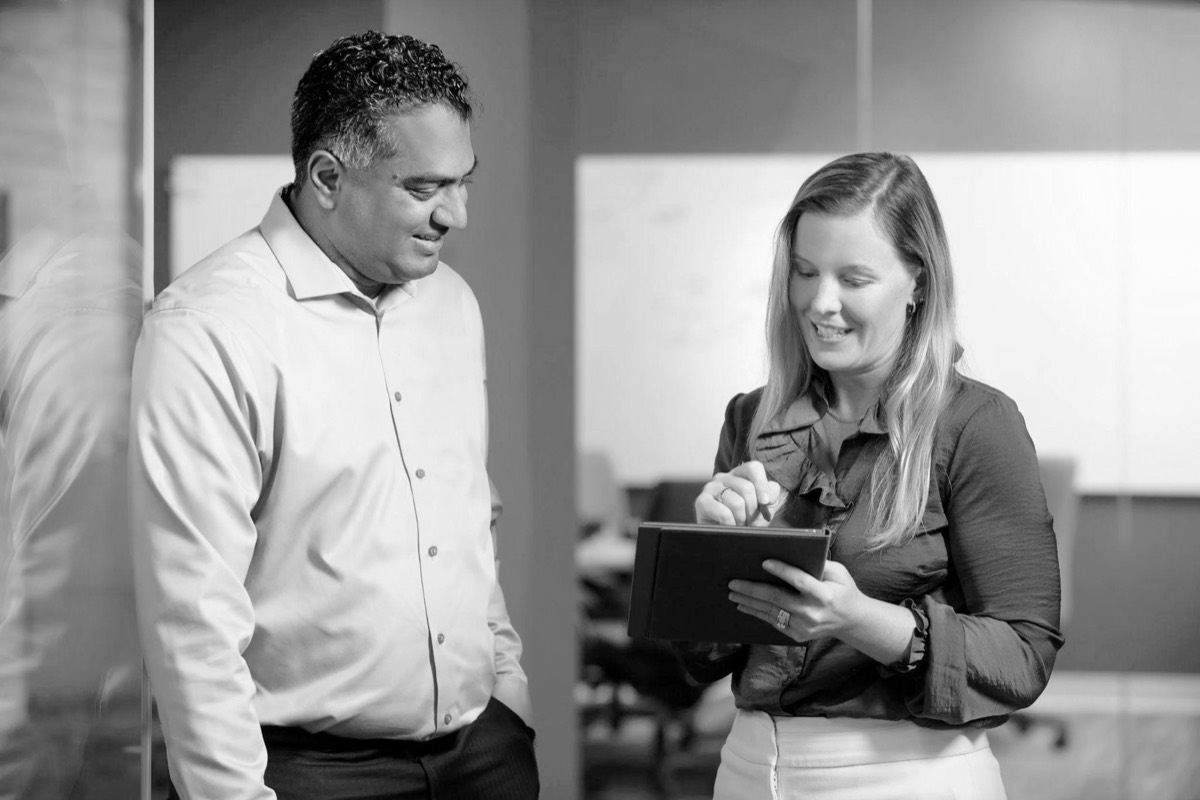 Two BlueTree partners reviewing notes together