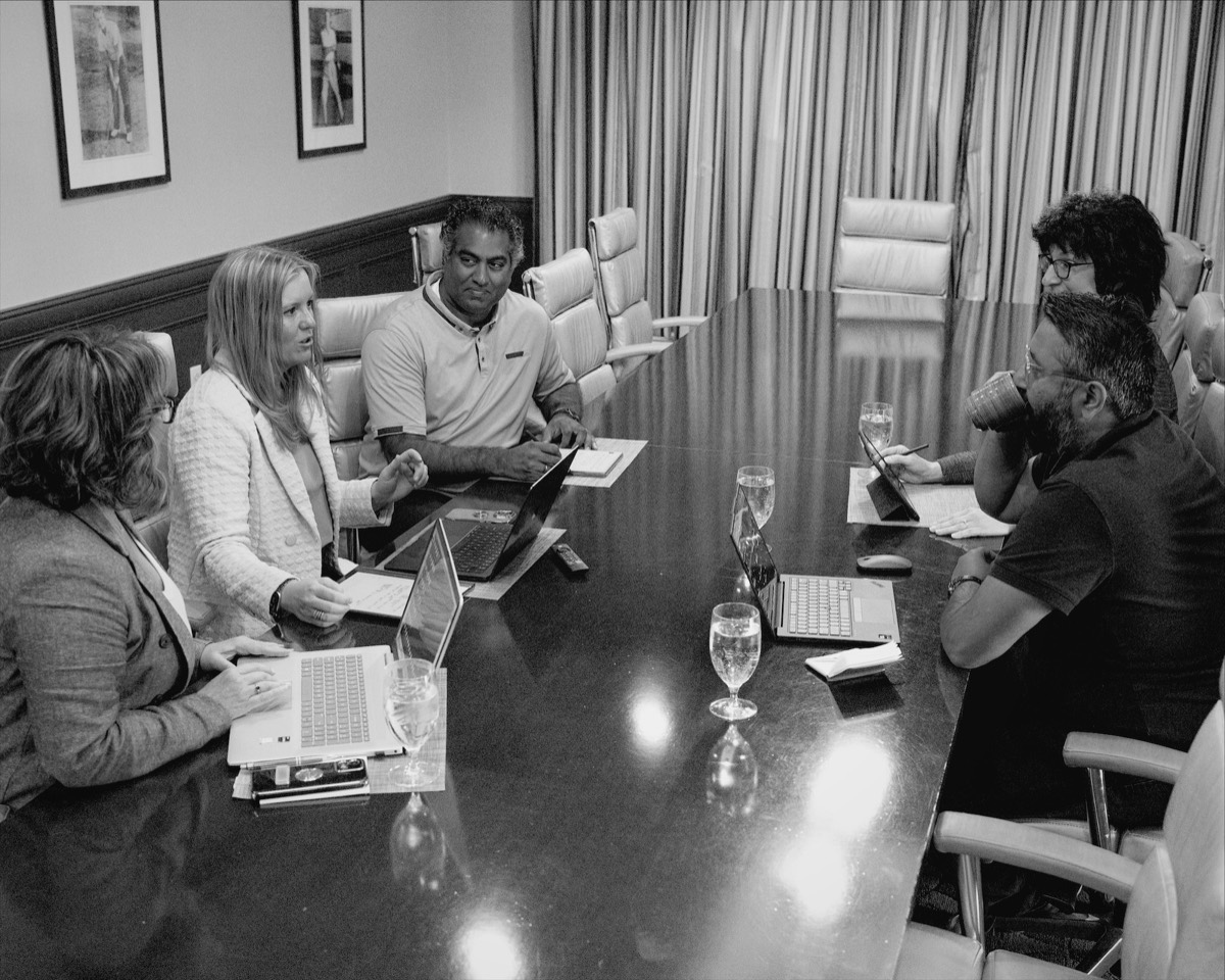 The BlueTree team working together around the boardroom table